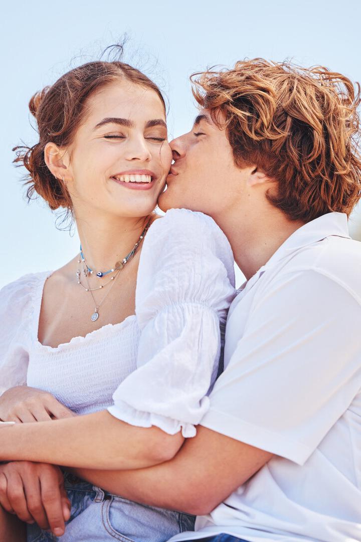 Shot of a young couple spending time together at the beach
