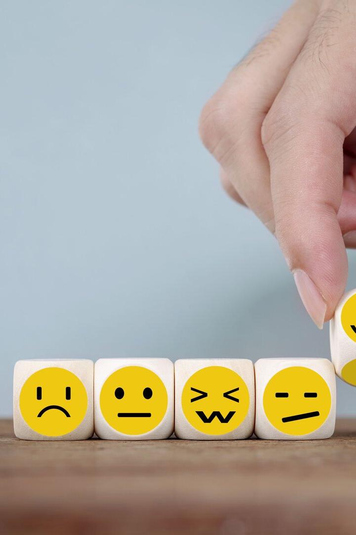 Hand Changing with smile emoticon icons face on Wooden Cube, hand flipping unhappy turning to happy symbol
