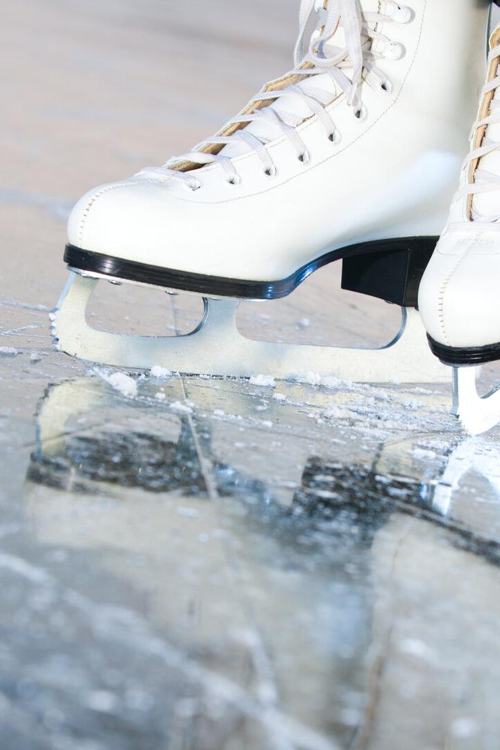Tilted natural version, ice skates with reflection