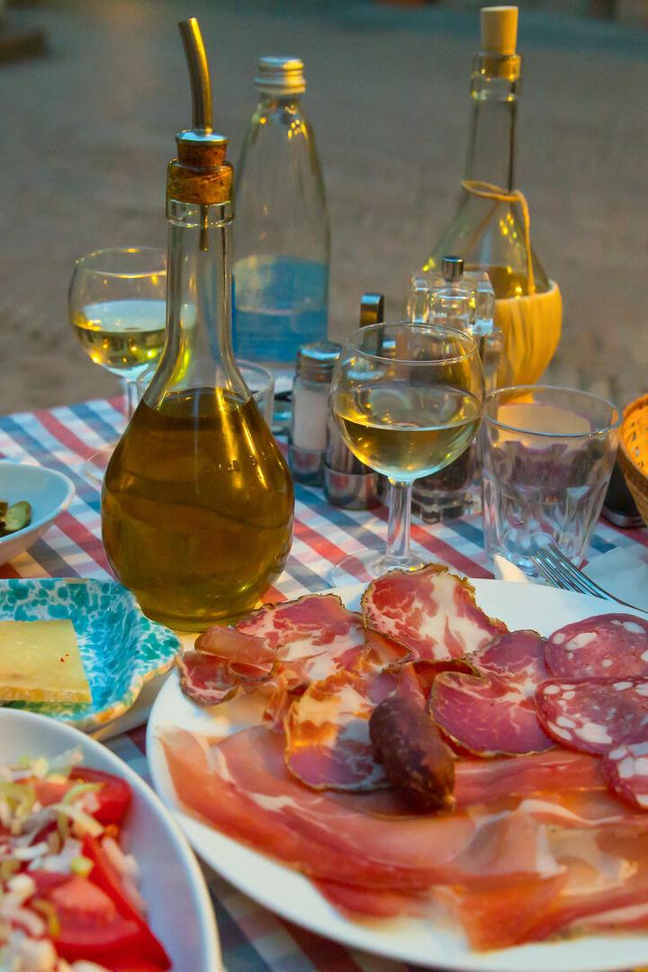 White wine and tasty italian homemade snack.