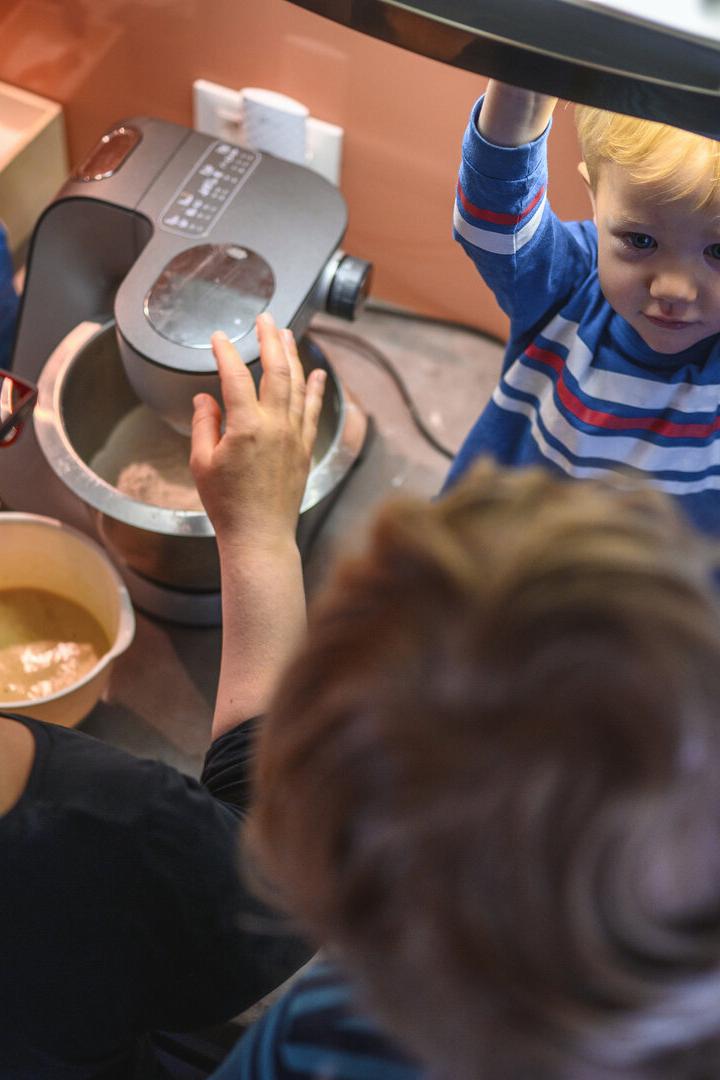 Mother and Sons Baking Cookies in the Morning