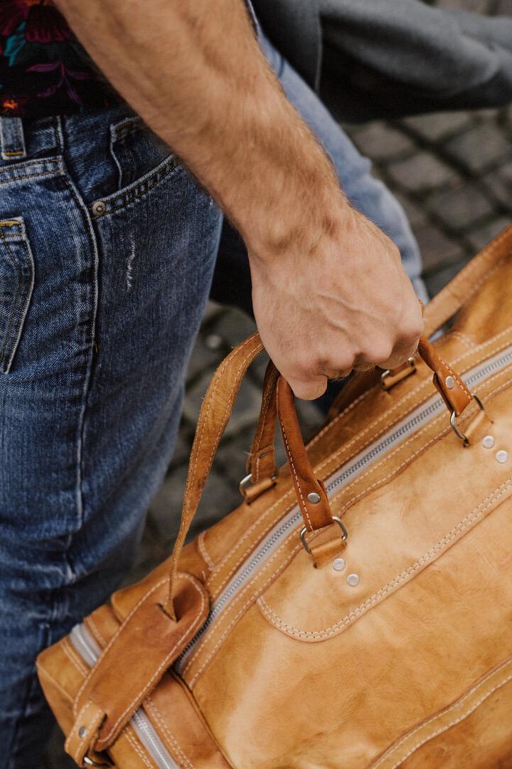 Man carrying bags and luggage