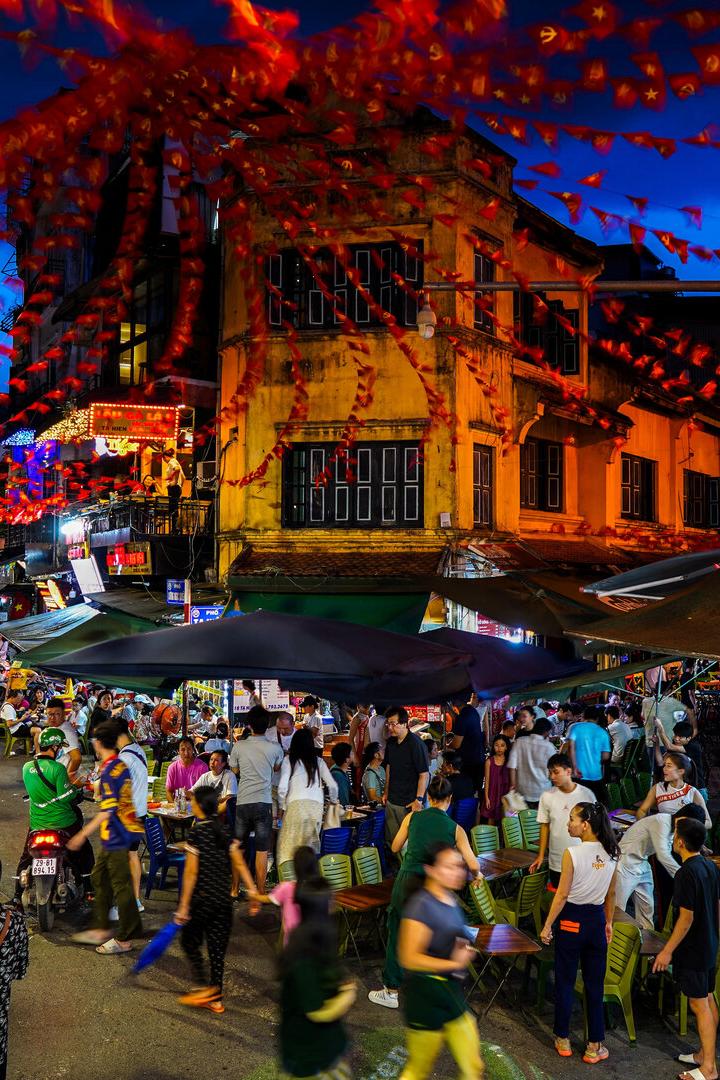 People spend their evening at Hanoi's Old Quarter, in Hanoi
