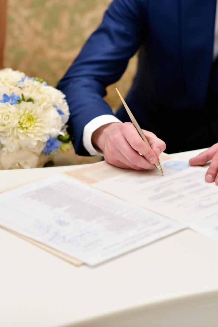Beauty bride and handsome groom are registering the marriage