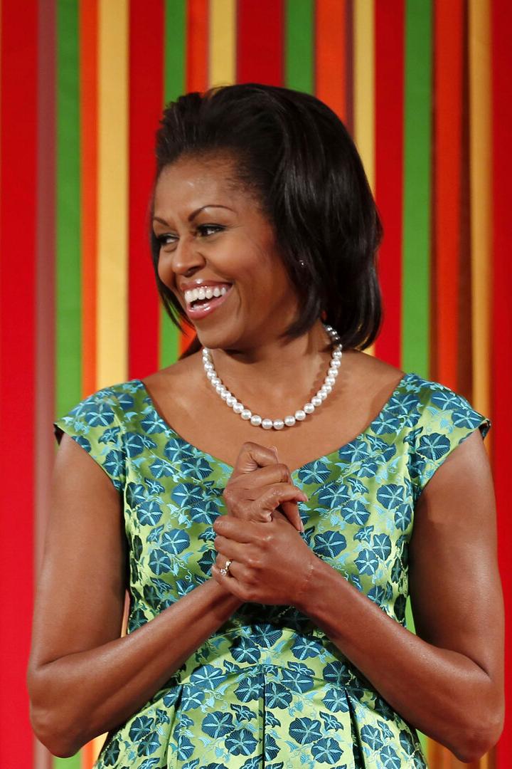 First lady Michelle Obama smiles at the first ever kids "State Dinner" at the White House in Washington