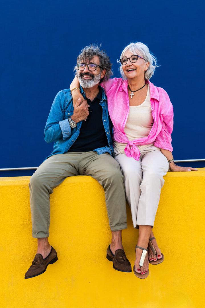Beautiful happy senior couple bonding outdoors