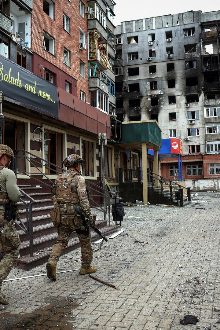 FILE PHOTO: Ukrainian police officers try to persuade residents to evacuate in the frontline town of Pokrovsk