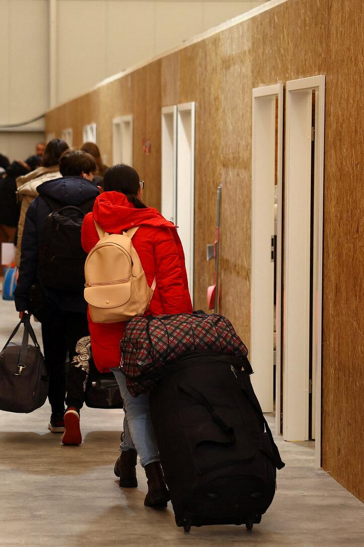 Ukrainian refugees arrive at a temporary shelter in Hanau
