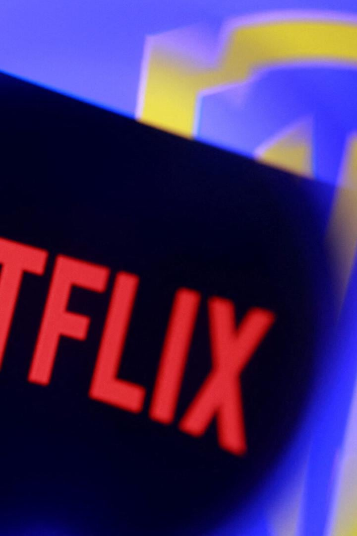 Illustration shows Netflix and Warner Bros logos