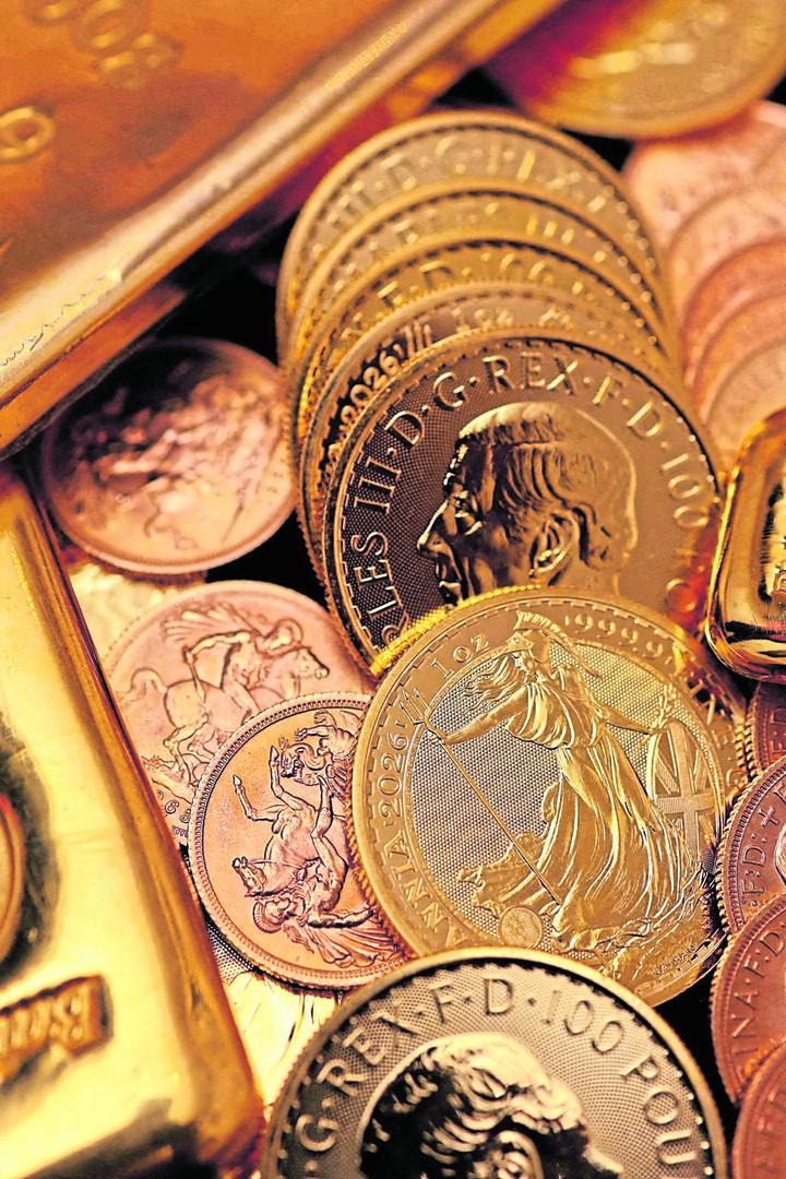 FILE PHOTO: UK gold bars and coins are displayed in London