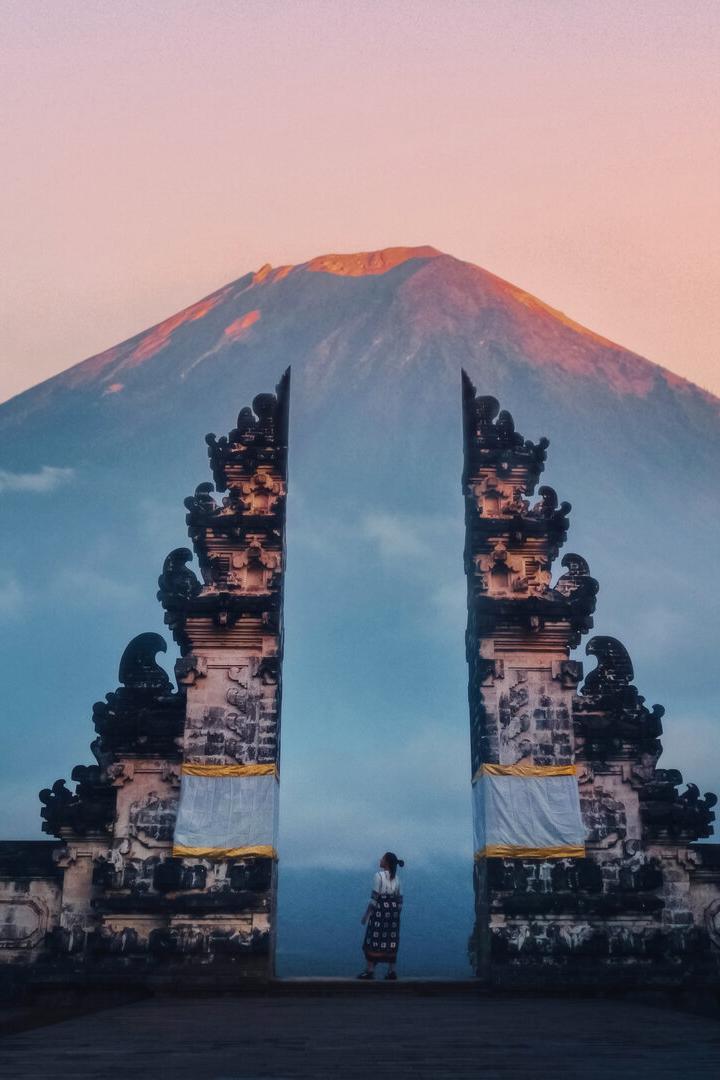 Traveler Standing at the Gates of Pura Lempuyang Temple aka Gates of Heaven Bali, Indonesia
