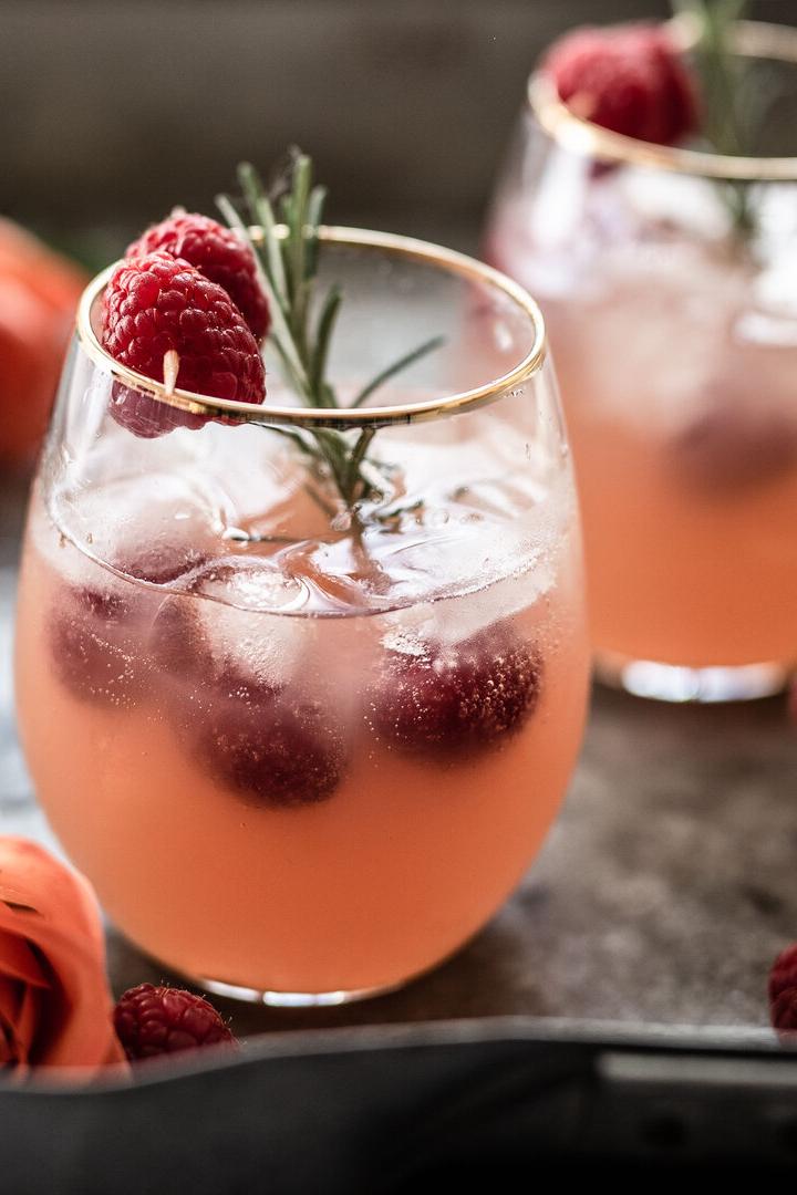 Cocktail with rosÃ© wine and raspberries