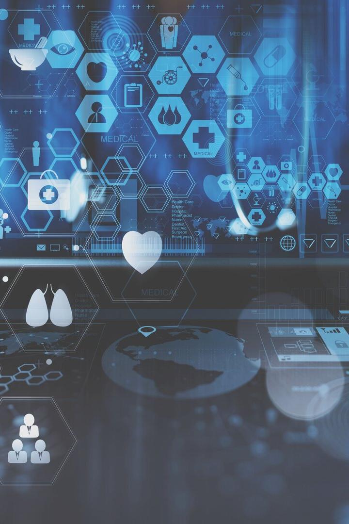 smart doctor hand working with modern laptop computer in modern office with virtual icon diagram