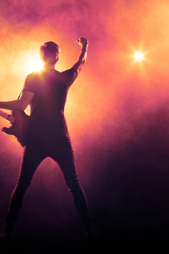 Guitarist playing a guitar on stage