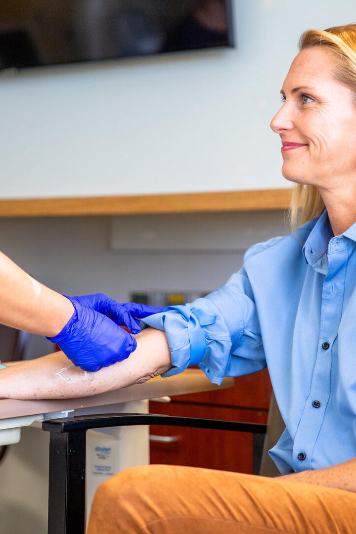 Blond Woman Phlebotomy Blood Draw in Hospital