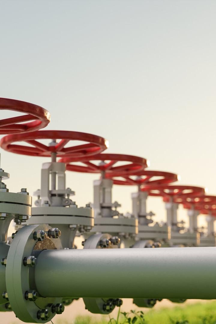 Oil, Gas Or Water Transportation With Pipe Line Valves On Grass.
