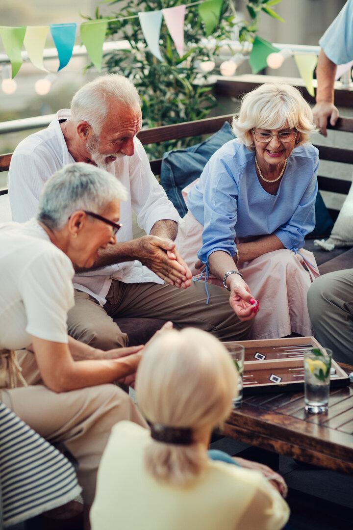 Senior Friends Playing Backgammon
