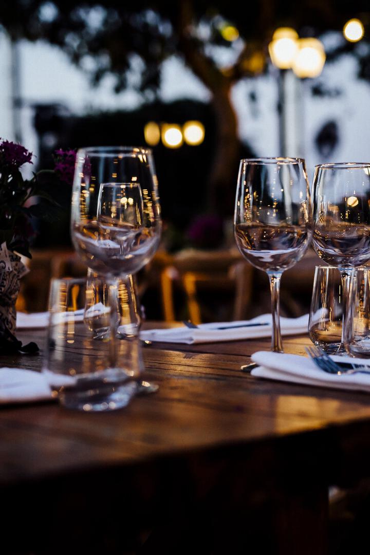 Luxury table settings for fine dining with and glassware, beautiful blurred  background. For events, weddings.