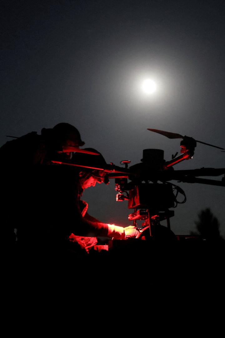 FILE PHOTO: Ukrainian servicemen prepare a heavy combat drone before flying it over positions of Russian troops near the frontline town of Chasiv Yar