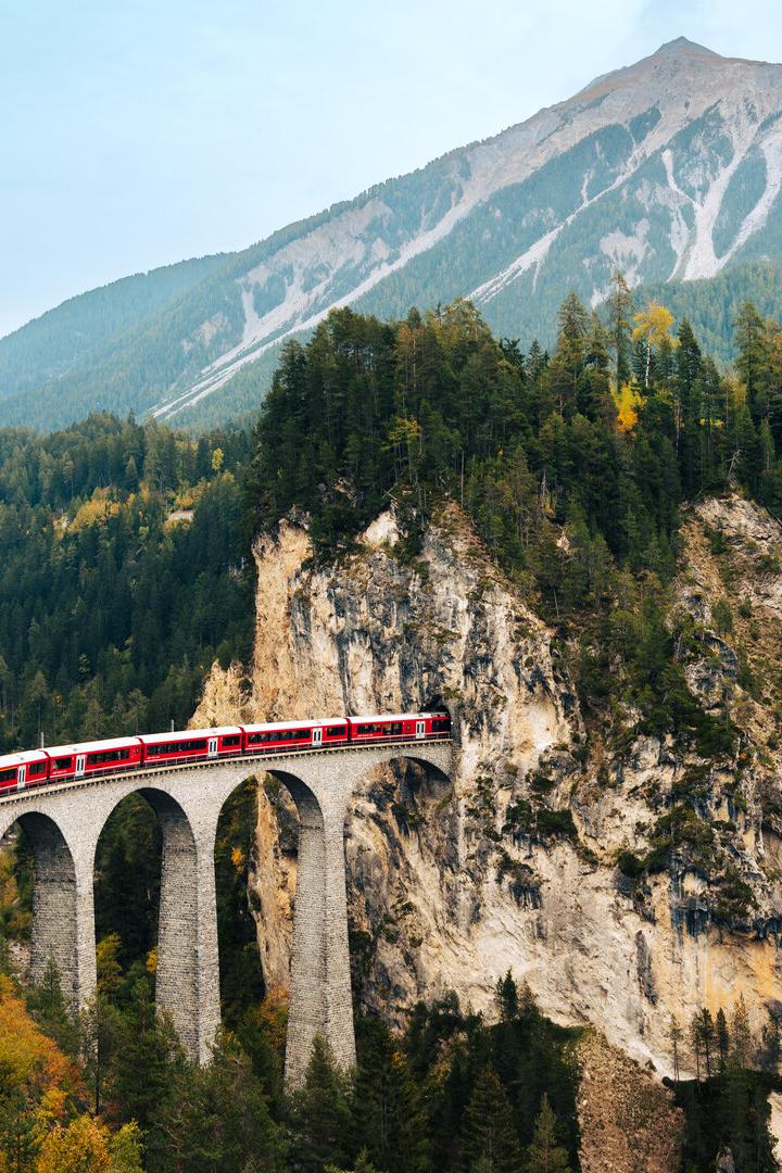 Scenic Train Journey Through Mountains in Switzerland