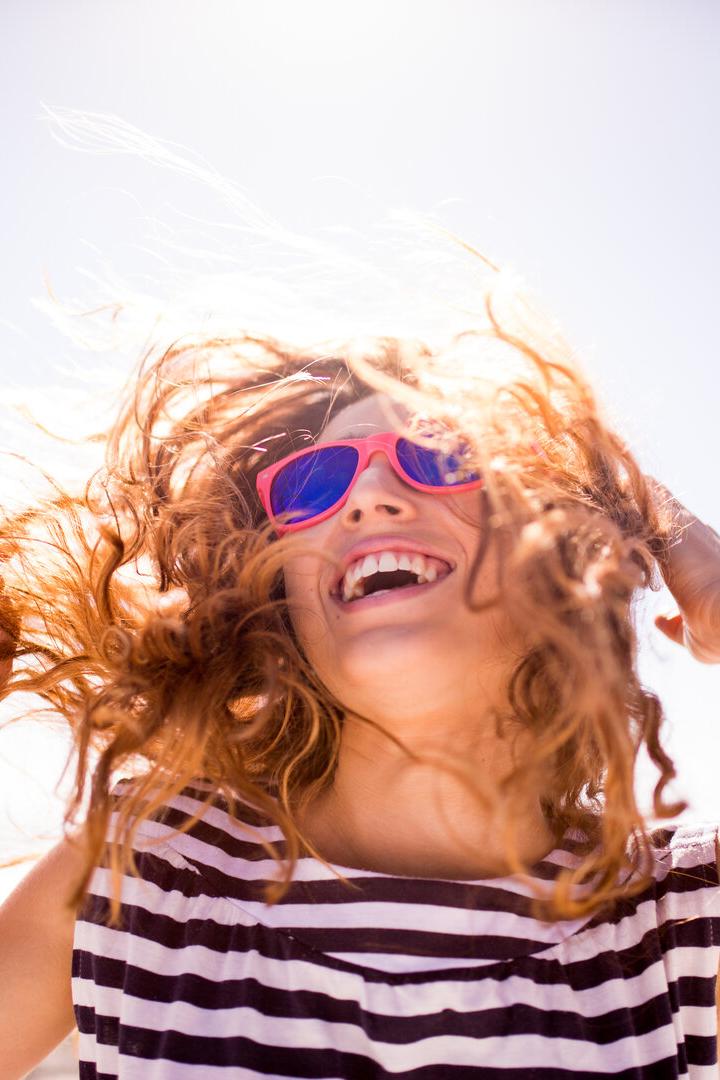 Cheerful laughing woman on the beach