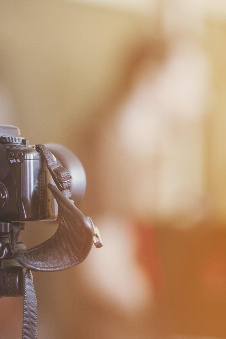 camera on a tripod indoor with beautiful blured background
