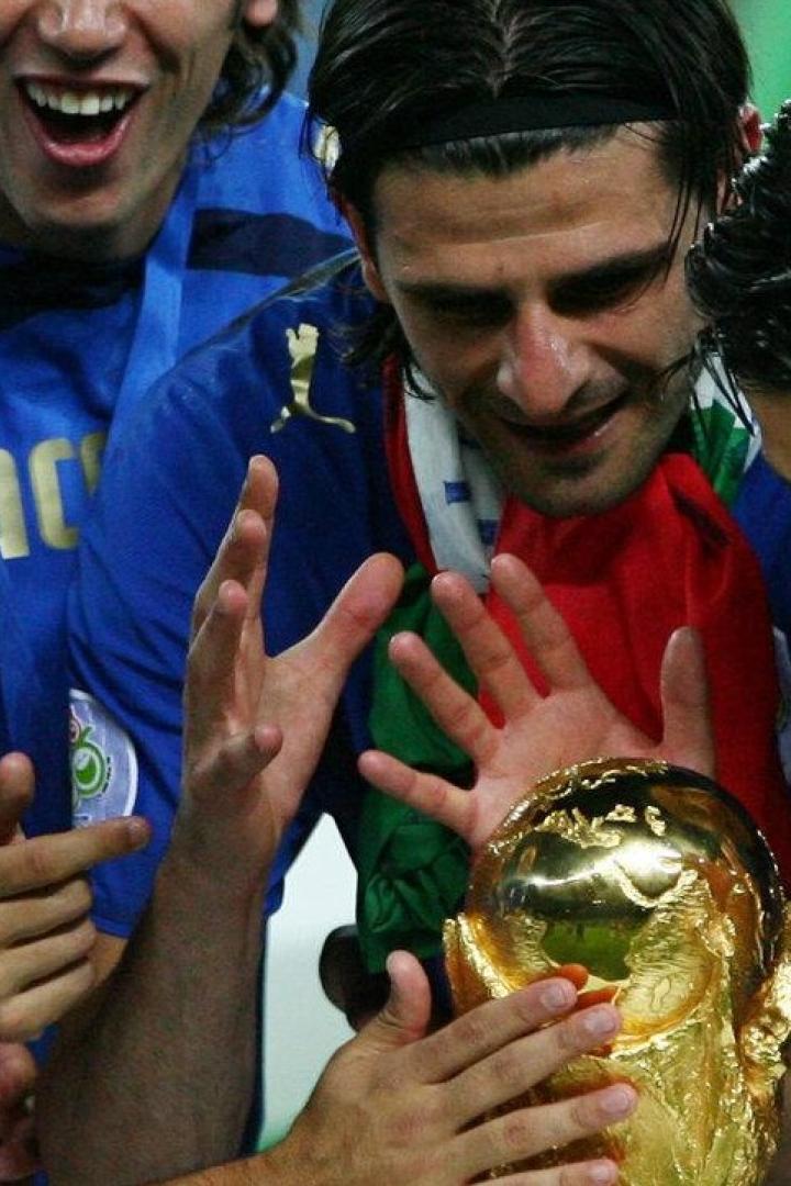 Italy players look at the World Cup Trophy after the World Cup 2006 final soccer match between Italy and France in Berlin