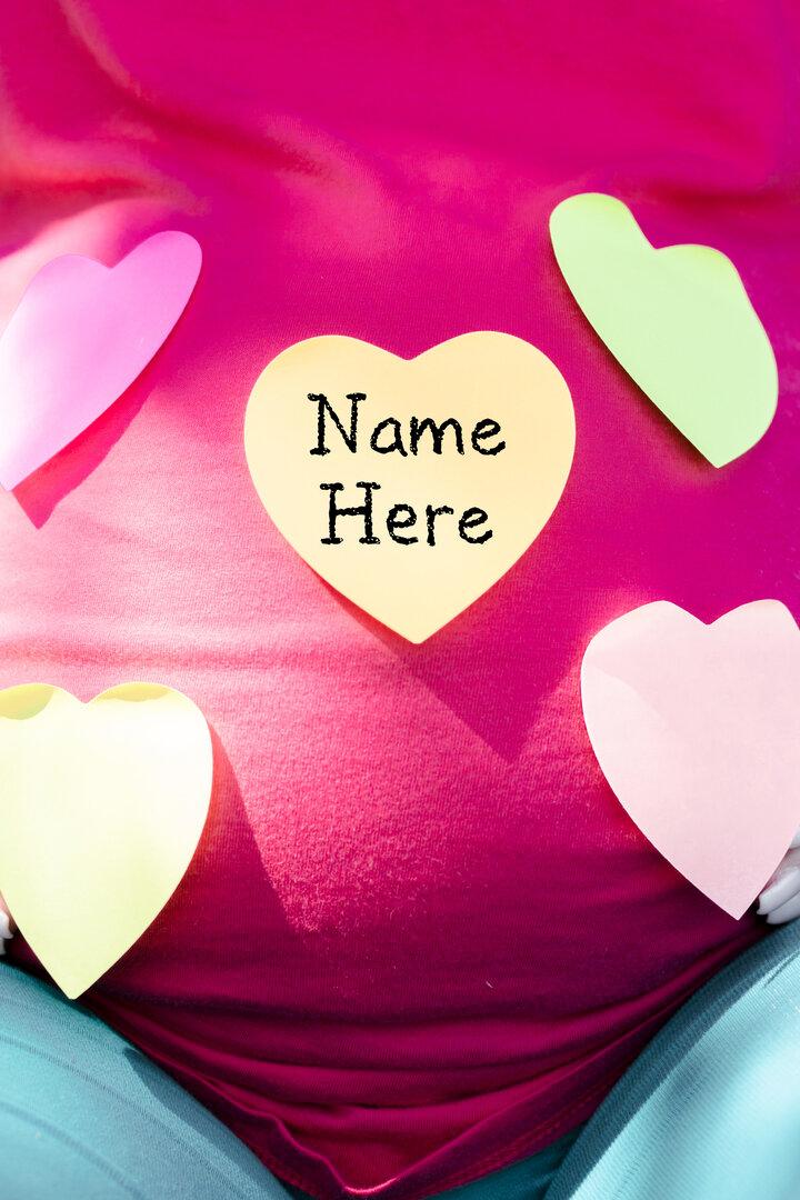 Pregnant woman choosing a name for a baby