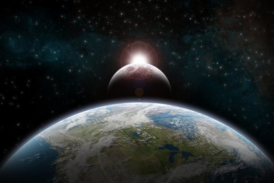 Eine Sonnenfinsternis über der Erde, gesehen aus dem Weltraum.