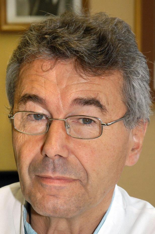 Univ.-Prof. DDr. Hubert Porteder Porträt eines Mannes mit Brille und grau meliertem Haar.