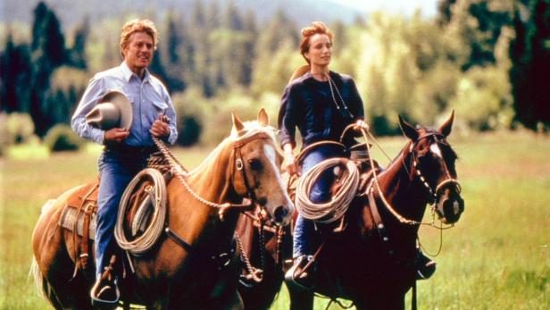 Robert Redford und Kristin Scott Thomas reiten in „Der Pferdeflüsterer“ auf Pferden.