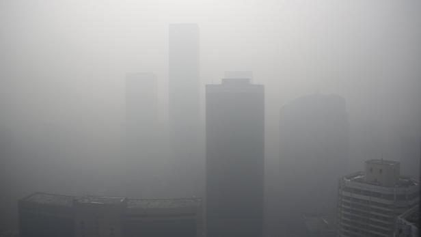 High-rise buildings are seen during a heavily poll