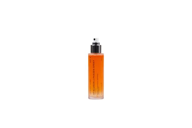 Ein orangerotes Hyaluron 2 Phasen Spray von „The Beauty Secret“.