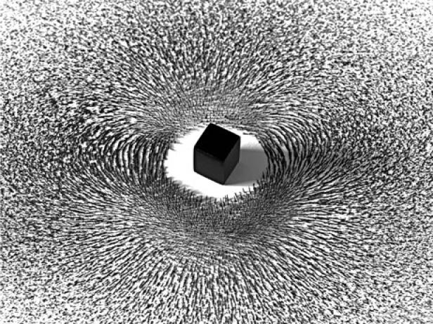 Ein schwarzer Würfel beeinflusst die Ausrichtung von Eisenspänen in einem Magnetfeld.