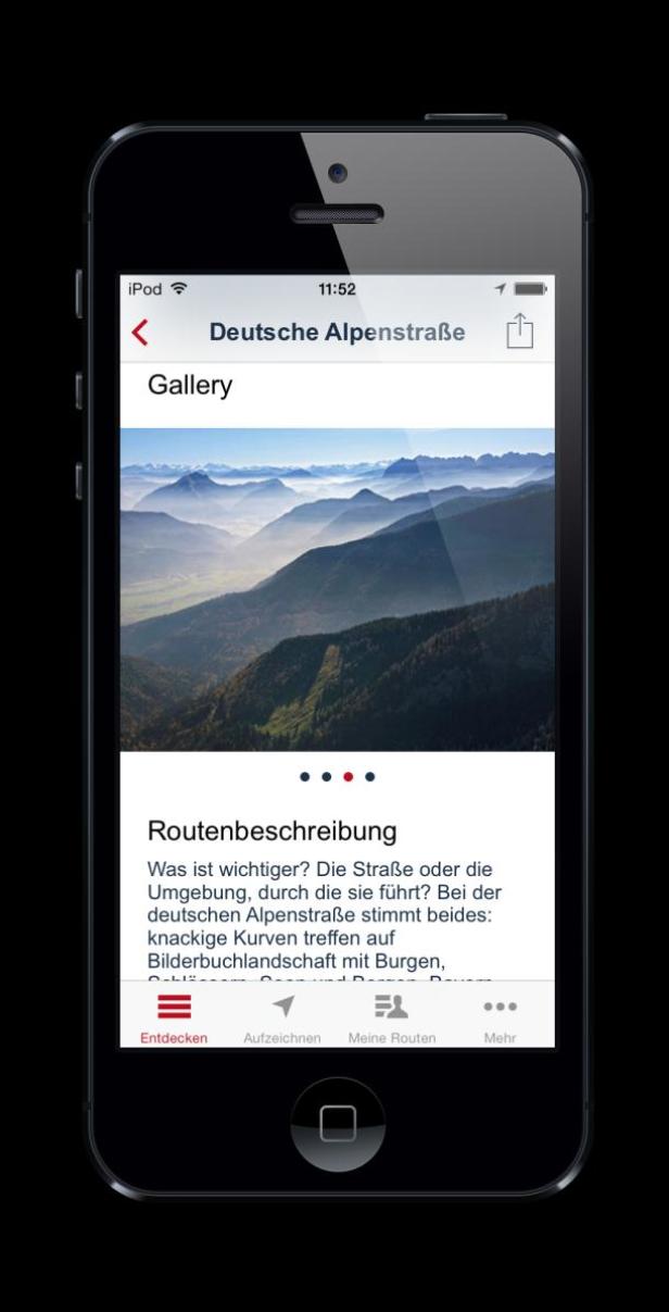 Ein iPhone zeigt eine App mit dem Titel „Deutsche Alpenstraße“ und einem Foto von Bergen.