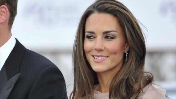 Britain's Prince William and his wife Catherine, D