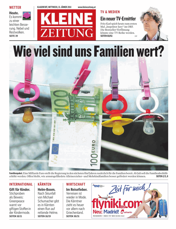 Schnuller und eine 100-Euro-Note hängen an einer Wäscheleine.