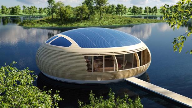 Ein modernes, rundes Hausboot mit Solarzellen auf einem See.