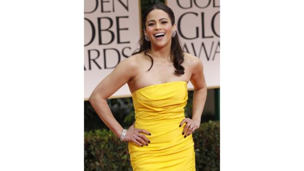 Paula Patton in einem gelben, trägerlosen Kleid auf dem roten Teppich.