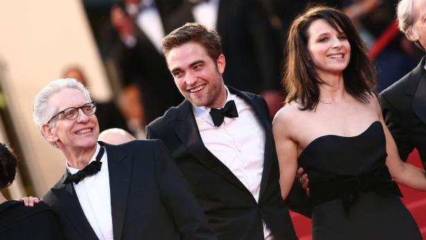 Robert Pattinson, Juliette Binoche und David Cronenberg auf dem roten Teppich in Cannes.