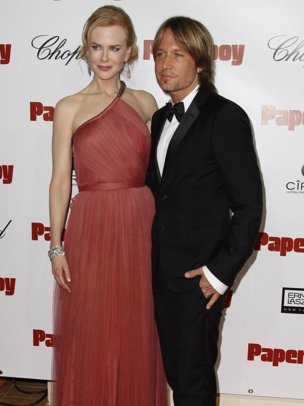 Nicole Kidman und Keith Urban posieren auf dem roten Teppich für „Paperboy“.