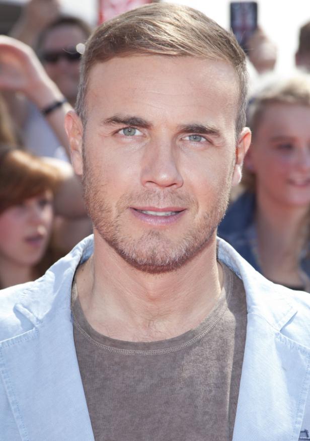 Porträt von Gary Barlow vor einer Menschenmenge.