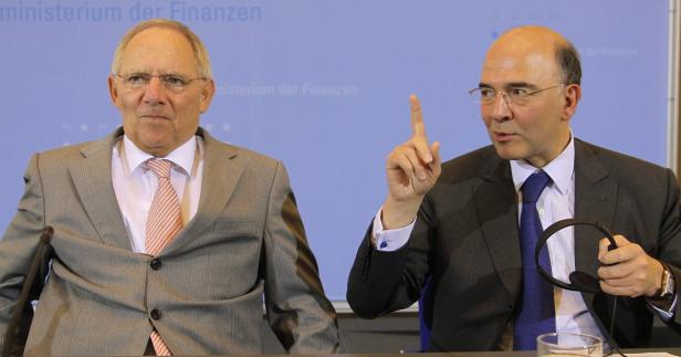 Wolfgang Schäuble und ein weiterer Mann bei einer Pressekonferenz.