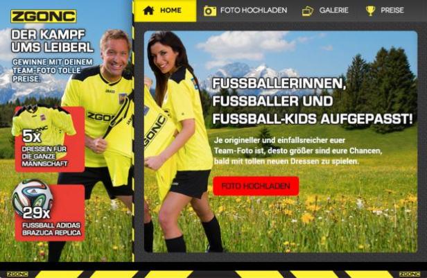 Ein Mann und eine Frau präsentieren gelbe Fußballtrikots der Marke ZGONC vor einer Berglandschaft.