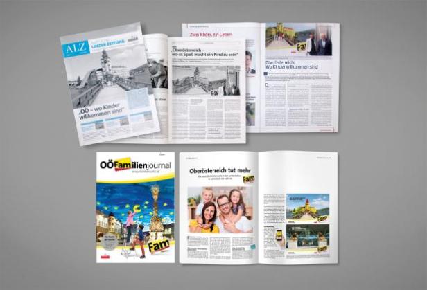 Mehrere Zeitschriften und Zeitungen liegen auf einem grauen Hintergrund.