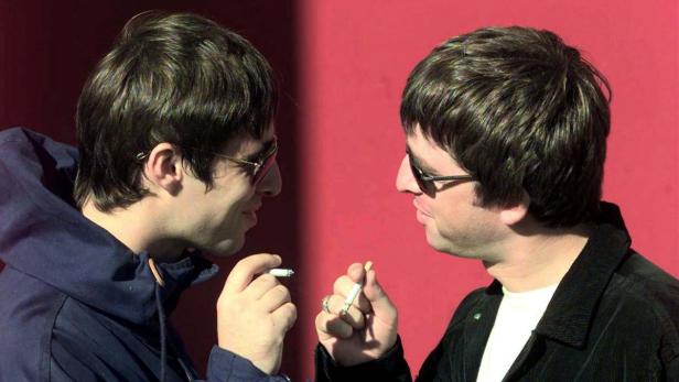 NOEL AND LIAM GALLAGHER OF OASIS POSE BEFORE CONCE