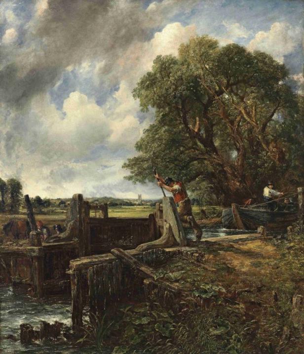 Ein Mann bedient eine Schleuse, während ein Boot wartet.