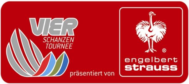 Das Logo der Vierschanzentournee, präsentiert von Engelbert Strauss, auf rotem Hintergrund.