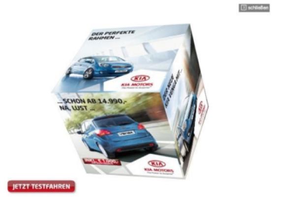 Ein Würfel zeigt Werbung für den Kia Venga mit dem Slogan „Der perfekte Rahmen…“.