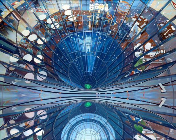 Ein Blick von oben in ein modernes Gebäude mit einem spiralförmigen Design und einem Café.